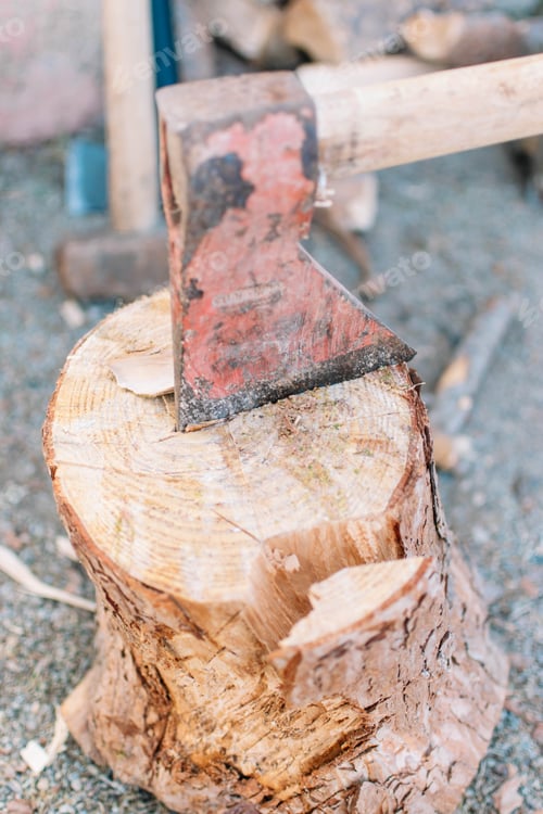 Preview: Hand ax hooked on a wooden stump