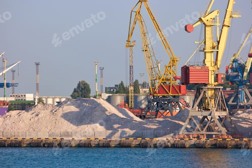Preview: Pile of sand on a sea port.