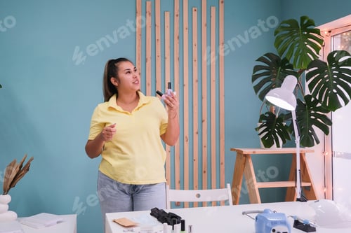 Preview: nail master preparing cozy salon for a client choosing nail polish