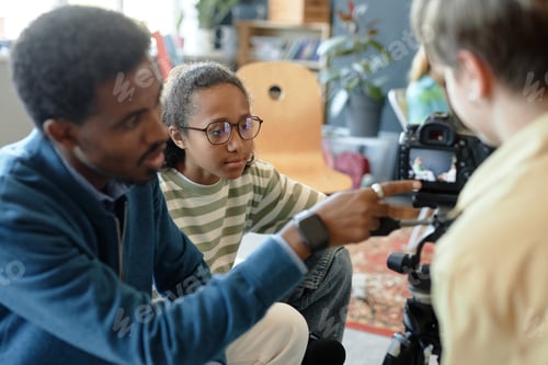 Preview: Kids setting up camera on tripod