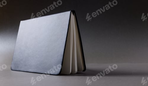 Preview: Close up of black notebook with copy space on black background