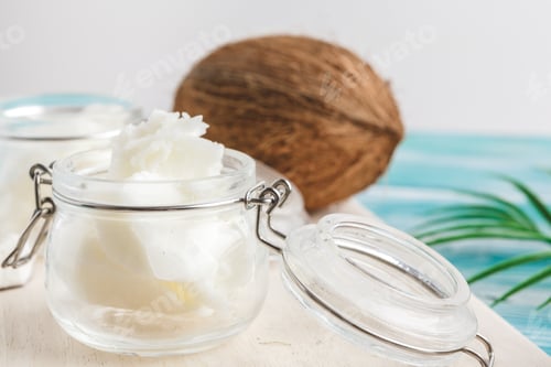 Preview: Coconut butter on wooden background. Organic healthy food concept