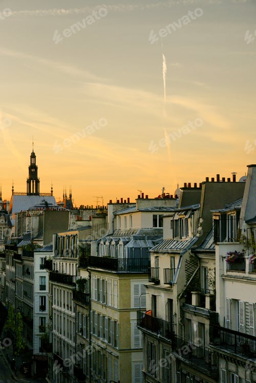 Preview: Panoramic View of Parisian Rooftops and Chimneys During Sunset