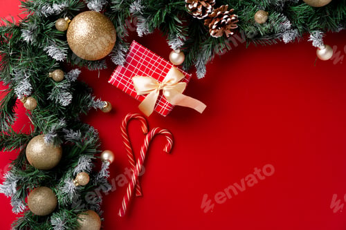 Preview: Frosted Christmas tree branches on red background