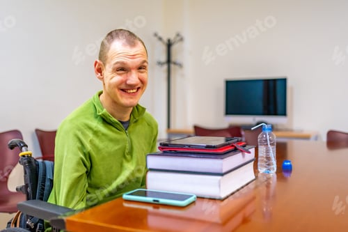 Preview: Man with disability sitting in wheelchair in the university