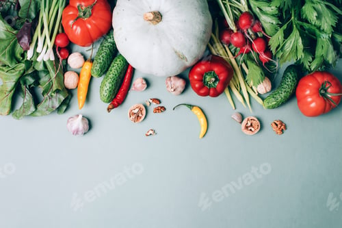 Preview: Autumn vegetables on green background. Top view. Vegan and vegetarian diet, harvest concept
