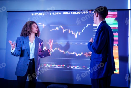 Preview: Business professionals discussing stock market trends in an urban office environment