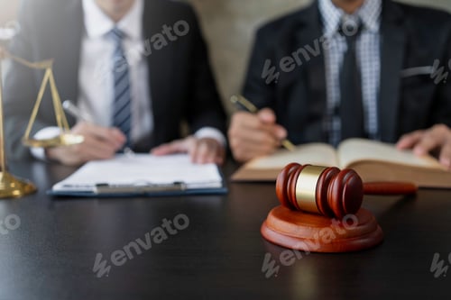 Preview: Attorney or judge provides legal advice to clients in the courtroom including the impartiality of th
