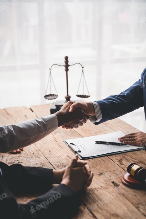 Preview: concept of justice and law A male judge in the courtroom on a wooden table and a male counselor or l