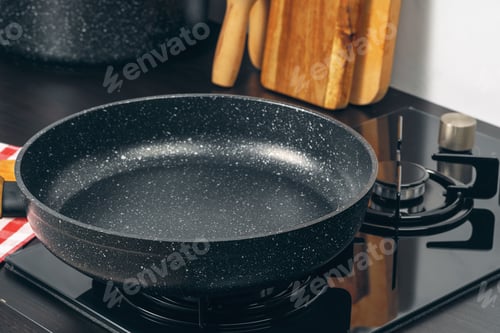 Preview: Frying pan on the gas stove in a kitchen
