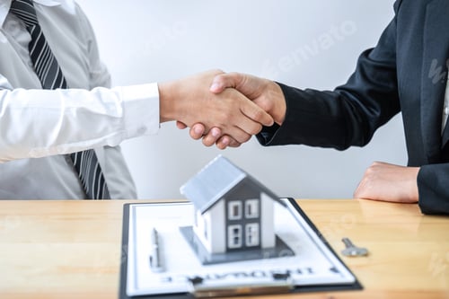 Preview: Real estate agent are shaking hands after good deal and giving house