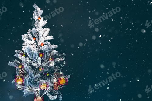 Preview: Beautiful decorated christmas tree with a lot of snow on vintage background