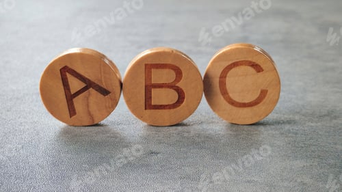 Preview: Wooden Alphabet Blocks "A," "B," and "C" on a Gray Surface