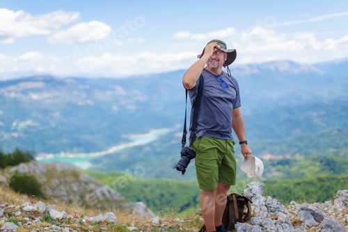 Preview: Mountain hiker photographer