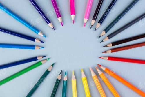 Preview: top view of colored pencils arranged on white background