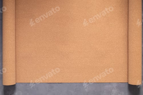 Preview: Roll of cork at cement floor background texture. Corkboard at wall