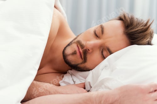 Preview: Man sleeping. Handsome young shirtless man sleeping in bed