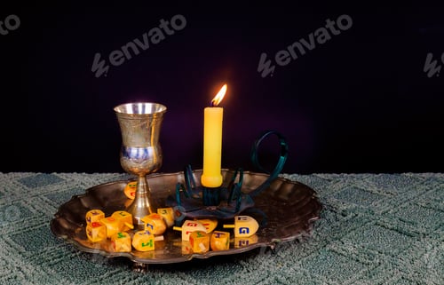 Preview: jewish holiday Hanukkahand wooden dreidels
