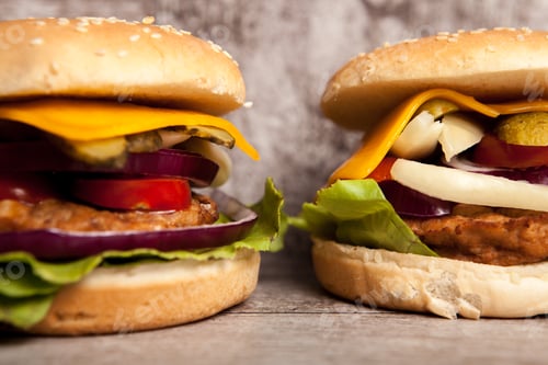Preview: Delicious tasty burgers on wooden background
