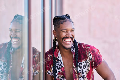 Preview: A man with dreadlocks is smiling