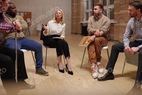 Preview: Psychologist interacting with group of patients