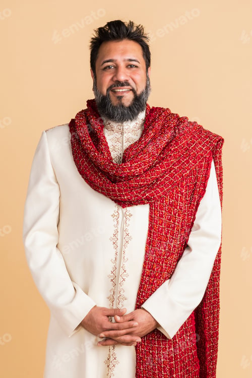 Preview: Happy Indian man wearing a kurta with a red scarf