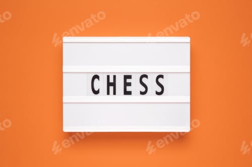 Preview: The word chess on lightbox isolated orange background.