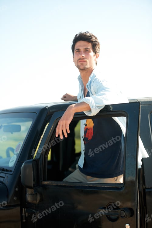 Preview: Soaking up the surroundings. A young man gazing into the distance.