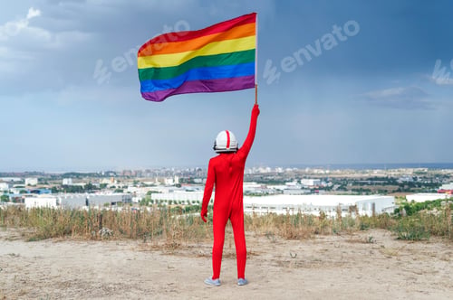 Preview: Astronaut with LGBT flag. View from behind
