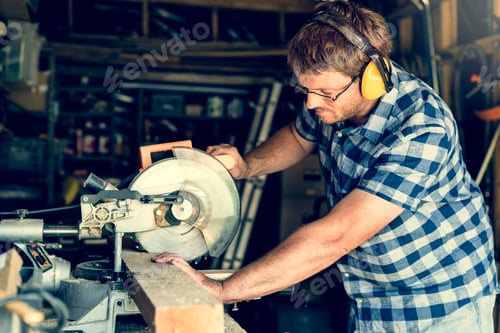 Preview: Man Works with a Circular Saw in Workshop
