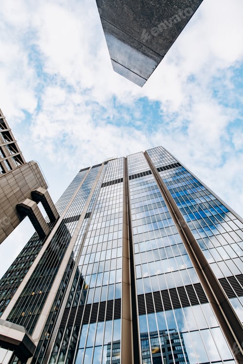 Preview: Modern Glass Skyscraper Against the Blue Sky