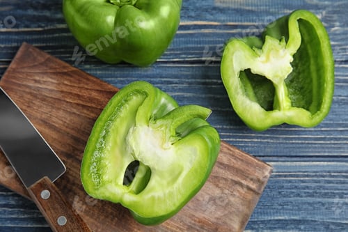 Preview: Raw ripe paprika peppers on wooden table, top view