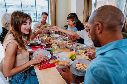 Preview: Family and friends reunion at home. Friends and family sharing a meal together at home