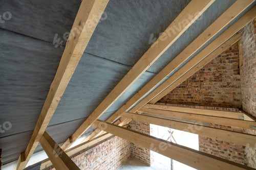 Preview: Attic space of a building under construction with wooden beams of a roof structure