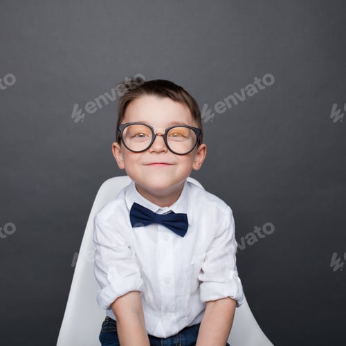 Preview: Adorable boy in glasses smiling at camera