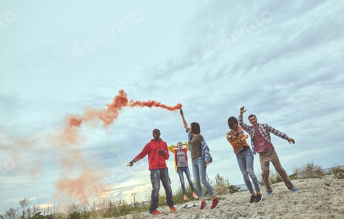 Preview: Time For Dancing. Full Length Portrait Of Men Amd Women Feeling Happy And Dancing With Smoke Flares