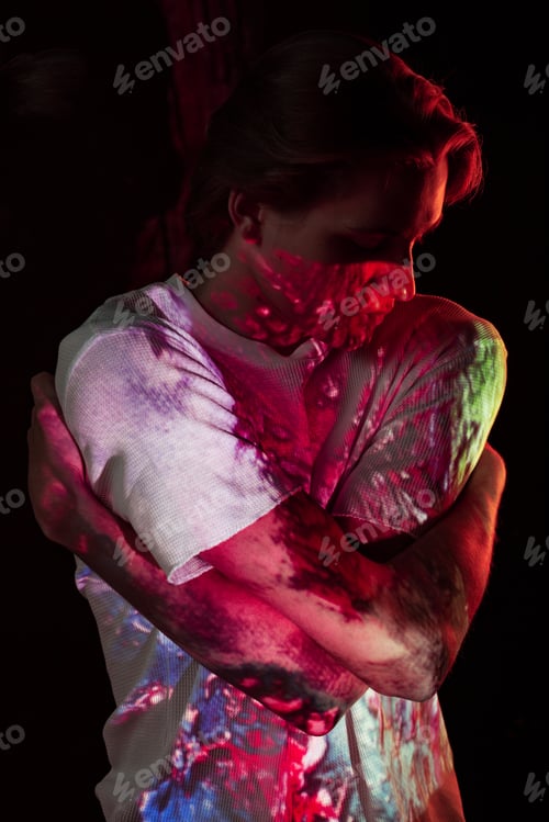 Preview: Young man illuminated with bright lights