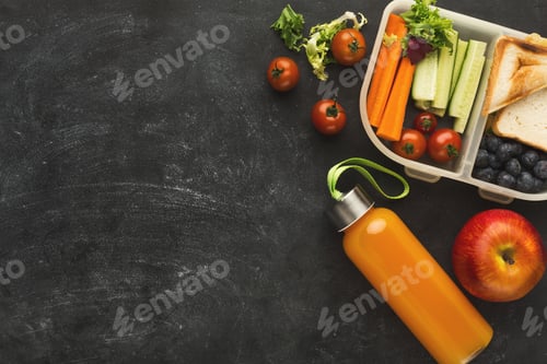 Preview: Lunch box with healthy food on black table background