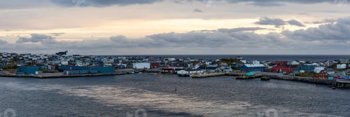 Preview: Homes in a little town on the rocky Atlantic Ocean Coast during a cloudy sunset