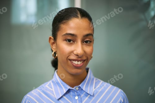 Preview: Portrait of Young Adult Black Woman Smiling Confidently in Business Setting