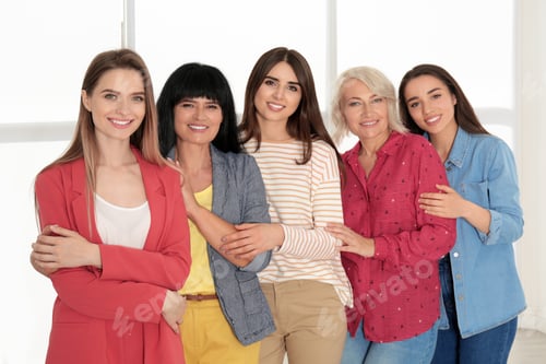 Preview: Group of ladies near window indoors. Women power concept