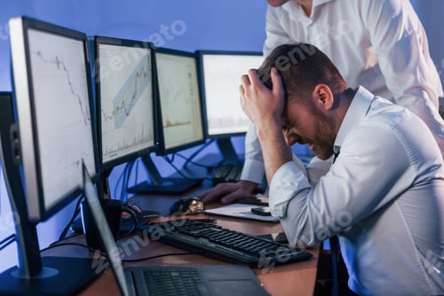 Preview: Bad luck, failure. Two stock traders working in the office with exchange technology