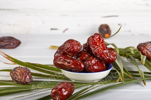 Preview: Date fruits with palm leaves, Raw Organic Dates Ready to Eat. Ramadan food concept