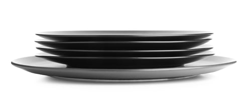 Preview: Stack of black ceramic plates isolated on white