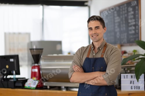 Preview: Entrepreneur small business owner standing in his modern coffee roastrery at doorway store.