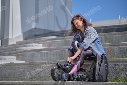 Preview: Fit legs in kangoo jumping shoes. womanpreparing for Kangoo Jumping training