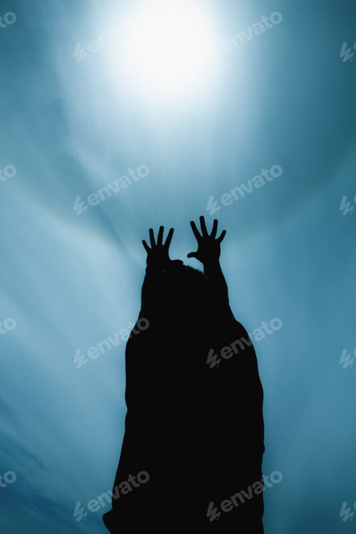 Preview: Silhouette of man with outstretched hands