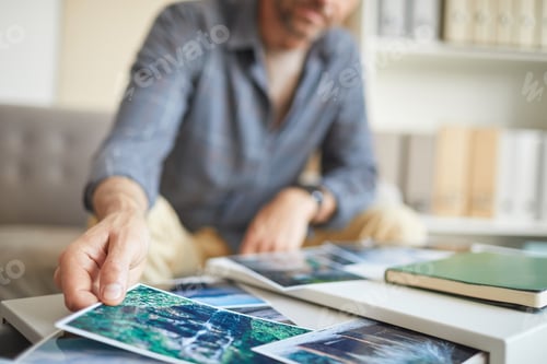 Preview: Designer working with his photos