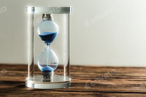 Preview: Modern hourglass on wooden background