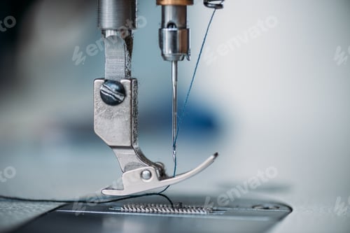 Preview: close-up shot of needle and thread of sewing machine